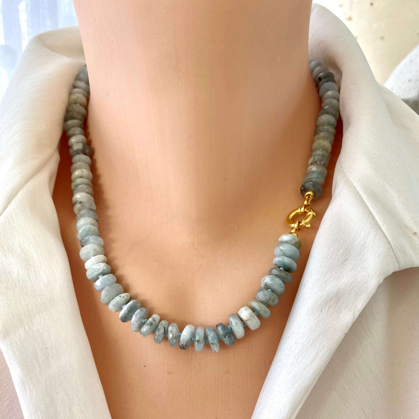 Aquamarine beaded necklace on mannequin showing marine clasp detail