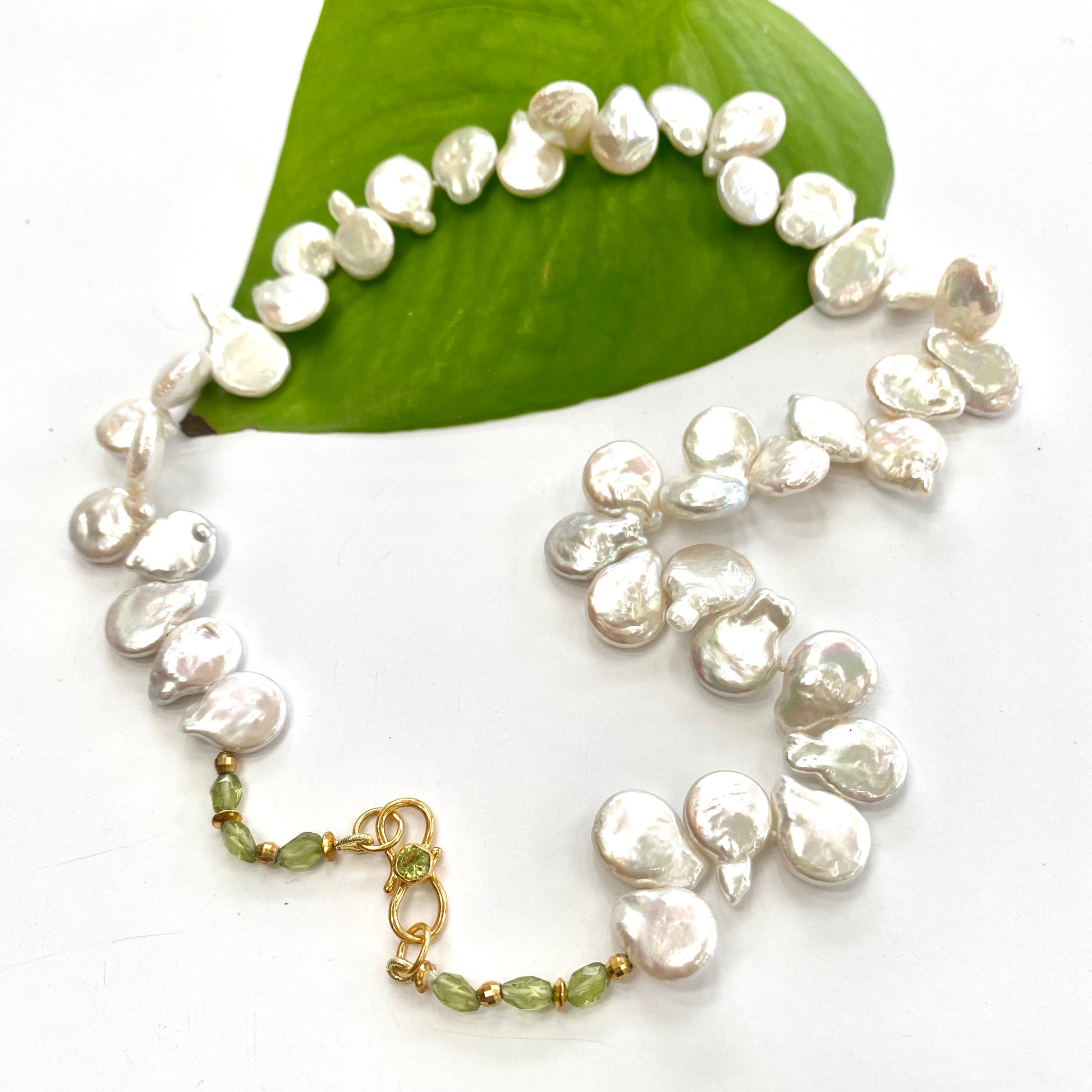 Keshi pearl necklace with garnet, citrine, and peridot, showcasing organic charm and elegance of freshwater pearls.