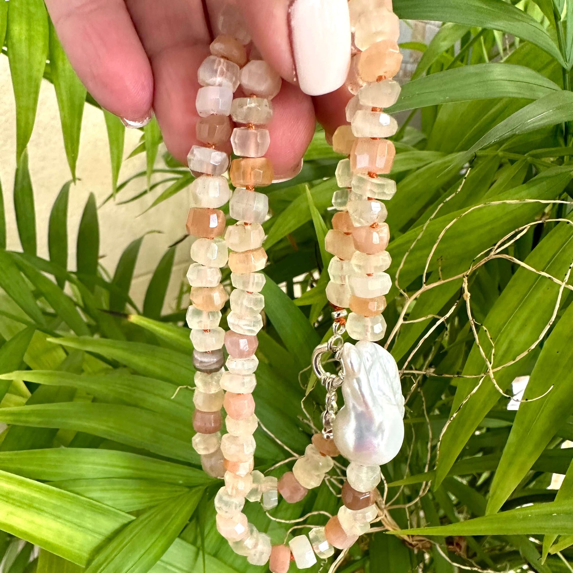 Detail shot of mixed moonstone and baroque pearl necklace with moonstone beads and baroque pearl centerpiece