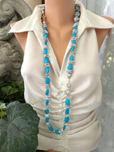 Load image into Gallery viewer, Long chunky turquoise and silver grey keshi pearl necklace worn on mannequin, draping to mid-torso
