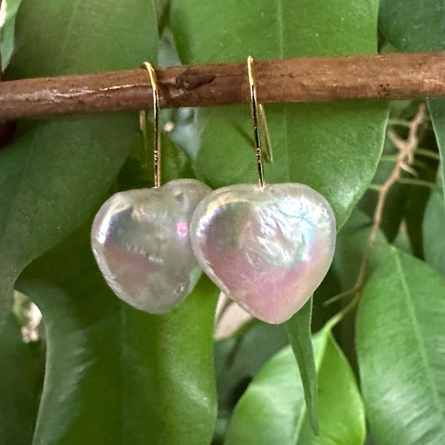 Heart shape freshwater pearl drop earrings showcasing a romantic design, handcrafted in Canada with beautiful shimmering pearls.