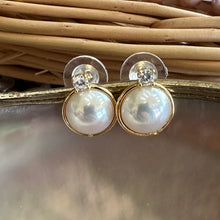 Load image into Gallery viewer, Mabe Edison pearl stud earrings in gold vermeil displayed on pearl and beige background

