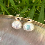 Nugget pearl stud earrings in gold vermeil on white pearl shell background