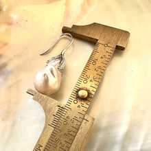 Charger l&#39;image dans la galerie, Close-up of white baroque pearl drop earrings measured against ruler on white pearl backdrop – handmade in Canada
