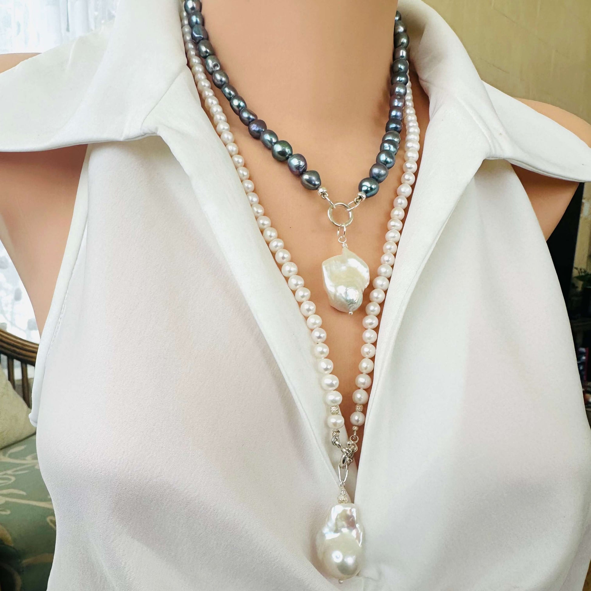 Handmade white pearl necklace with baroque pendant, elegant side angle view