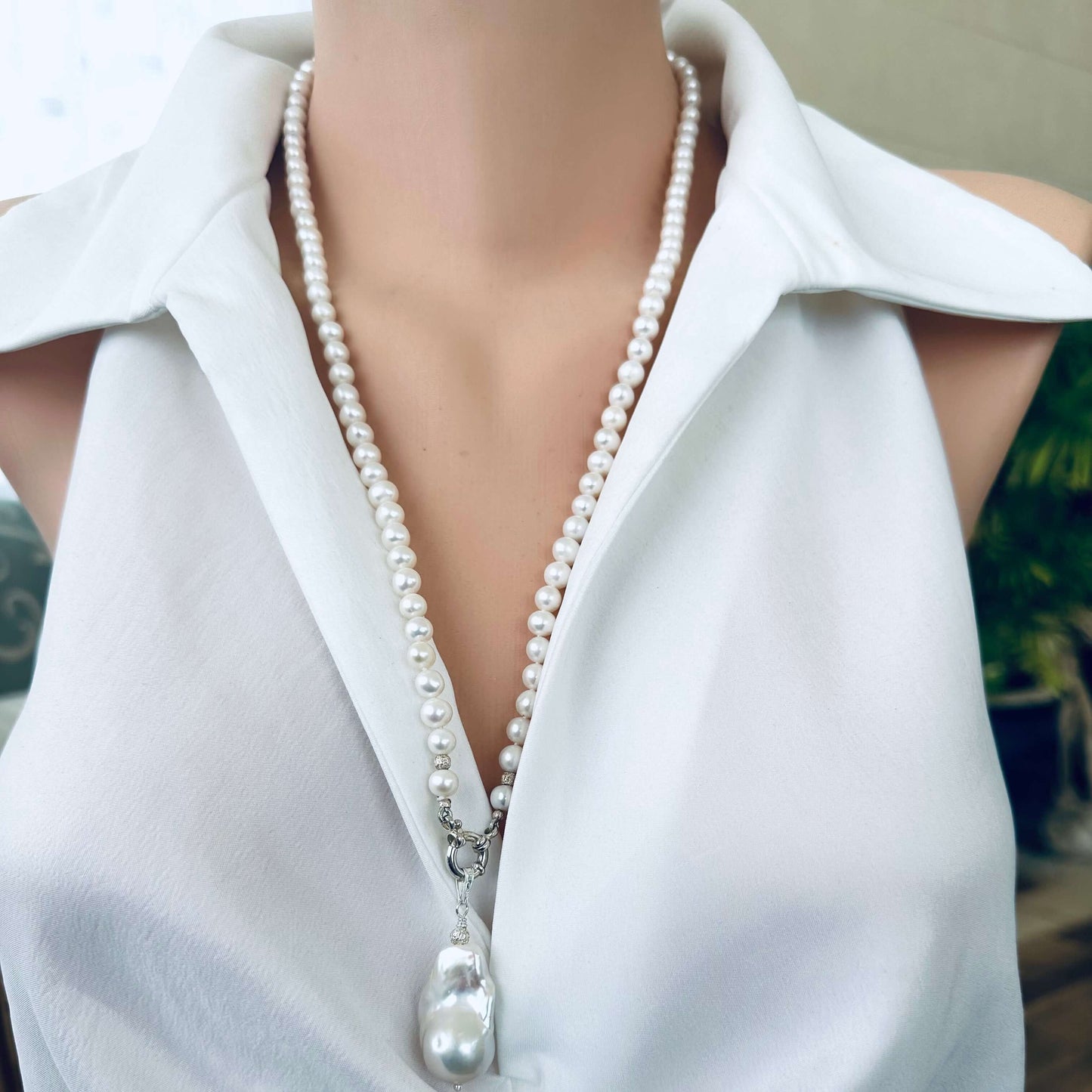 Front view of white pearl necklace with baroque pendant, classic handmade design