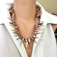 Front view of pink Biwa pearl necklace on mannequin, bold statement design
