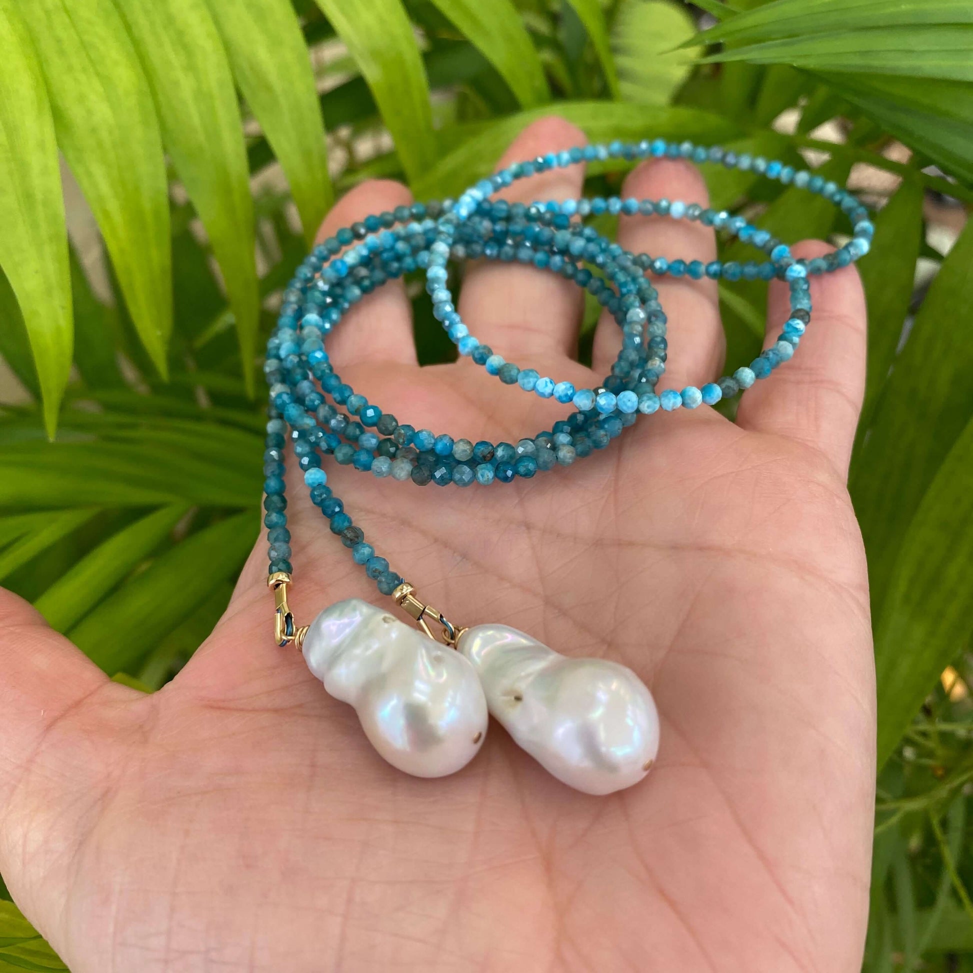 Blue Apatite Lariat Necklace with Baroque Pearls, handmade in Canada, showcasing vibrant gemstones and elegant freshwater pearls.
