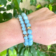 Load image into Gallery viewer, Aquamarine stretch bracelet featuring 6mm and 8mm AAA Aquamarine beads with 14K gold filled accents.

