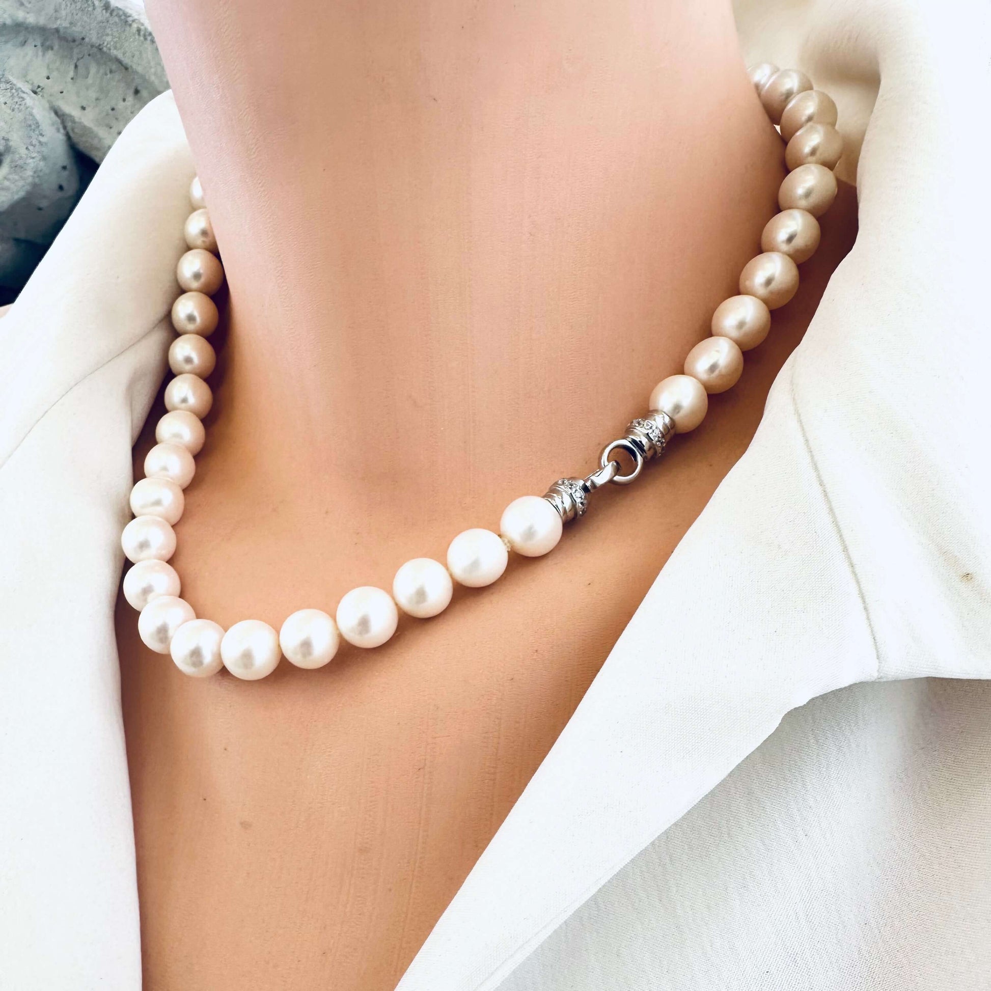 White pearl necklace cross pendant shown on mannequin side view without pendant — handcrafted freshwater pearl jewelry by Loulia Pearl Jewelry