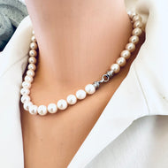 White pearl necklace cross pendant shown on mannequin side view without pendant — handcrafted freshwater pearl jewelry by Loulia Pearl Jewelry