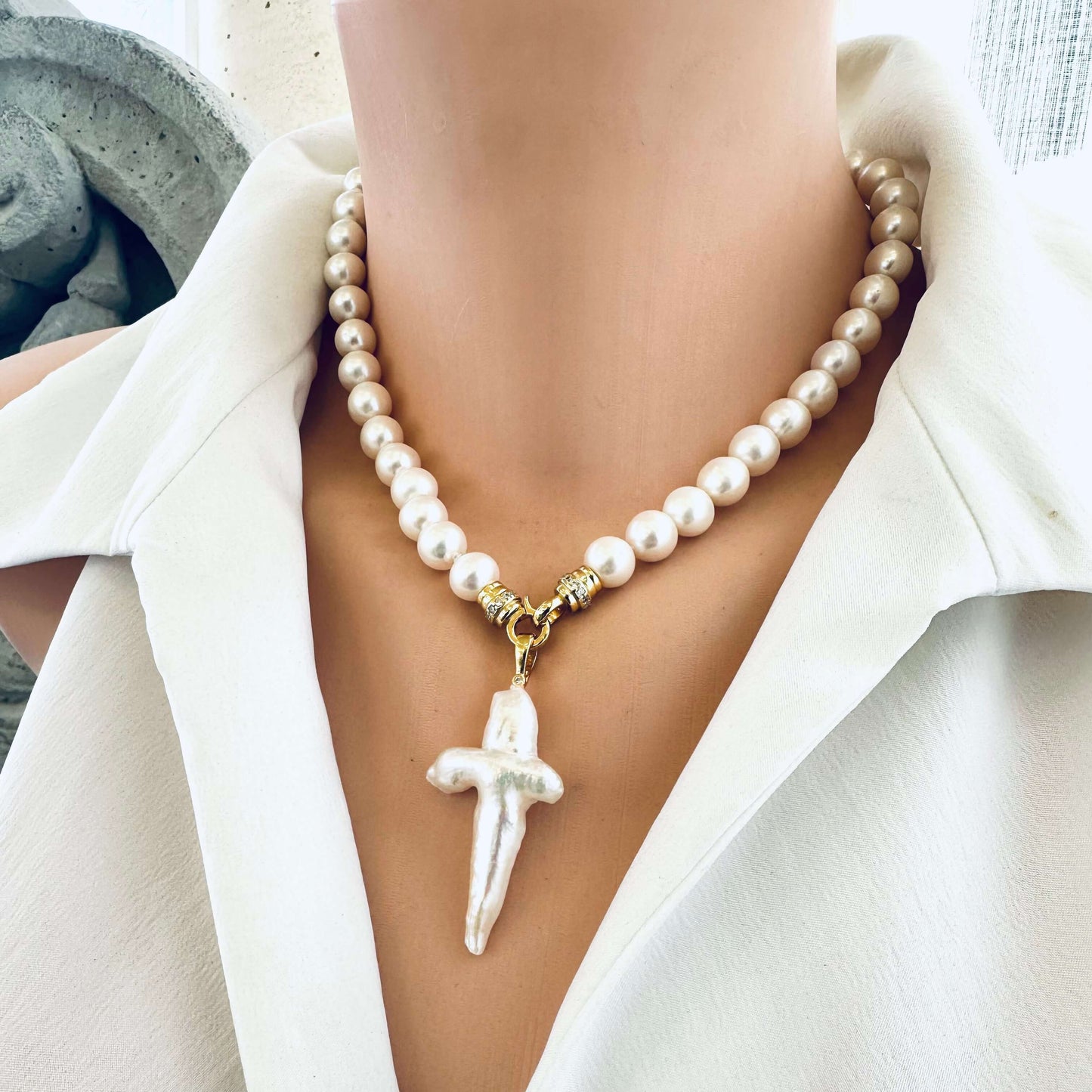 White pearl necklace cross pendant front view on mannequin — elegant handcrafted freshwater pearl jewelry with gold clasp by Loulia Pearl Jewelry