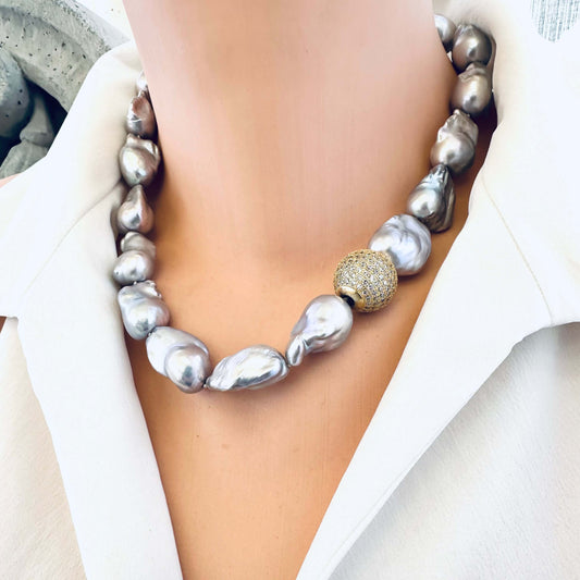Side view of silver grey baroque pearl necklace on mannequin display