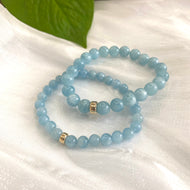 Aquamarine stretch bracelet made of 6mm and 8mm AAA Aquamarine beads with 14K gold filled accents.