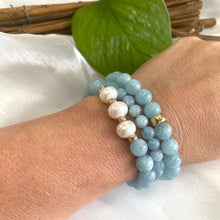 Load image into Gallery viewer, Aquamarine pearl bracelet featuring 8mm Aquamarine beads and 9-10mm freshwater pearls on a wrist.
