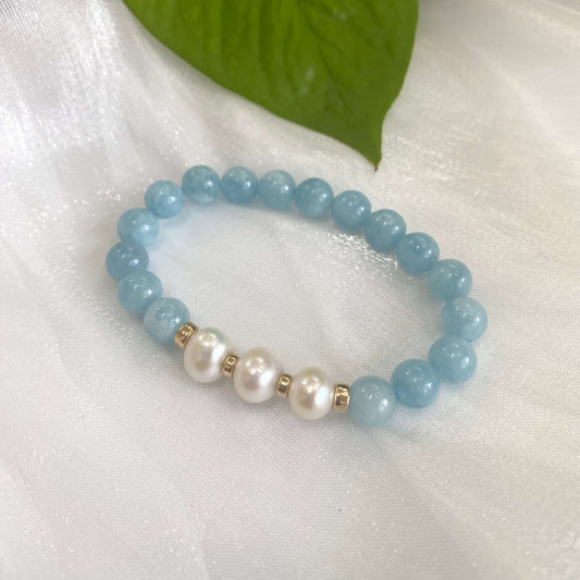 Aquamarine pearl bracelet with 8mm beads and 14K gold filled accents, showcasing blue aquamarine and freshwater pearls.