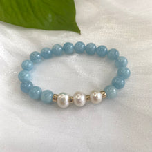 Load image into Gallery viewer, Aquamarine pearl bracelet featuring 8mm aquamarine beads and 9-10mm freshwater pearls with gold accents.
