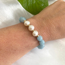 Load image into Gallery viewer, Aquamarine pearl bracelet featuring 8mm Aquamarine beads and 9–10mm freshwater pearls on a wrist.
