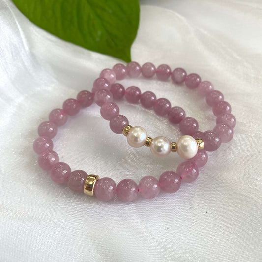 Rose Quartz Pearl Bracelet pair displayed on white cloth – two-bracelet close-up