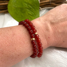 Load image into Gallery viewer, Red Agate Bracelet featuring 6mm beads paired with 14K Gold Filled accents worn on a wrist.
