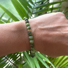 Load image into Gallery viewer, Chrysoprase Stretch Bracelet – 6mm Beads in 14K Gold Filled worn on wrist with green tones and natural design
