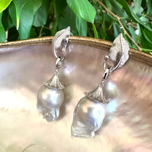 Charger l&#39;image dans la galerie, Leaf Design Baroque Pearl Earrings photographed against green leaf background — botanical sterling silver jewelry by Loulia Pearl Jewelry
