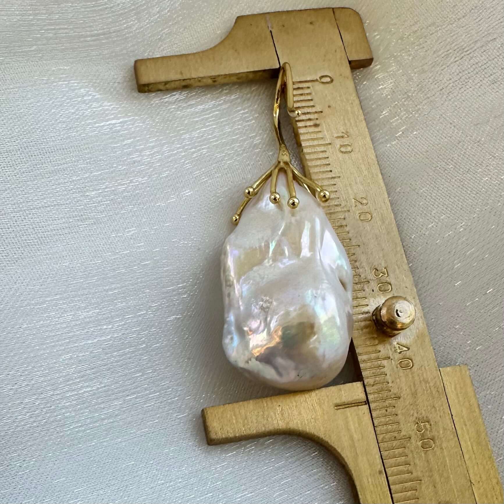 Baroque pearl drop earring size comparison with ruler, white freshwater pearls shown in detail