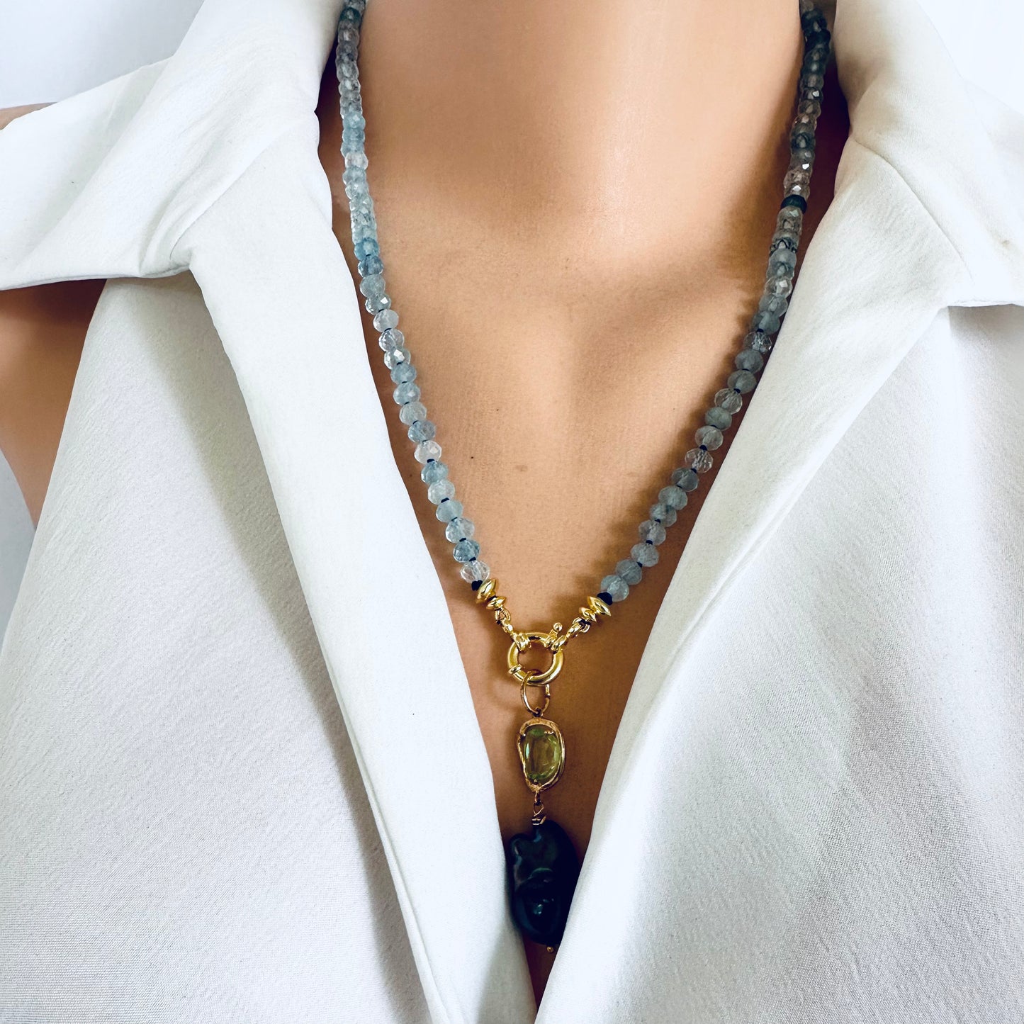 Aquamarine baroque pearl necklace featuring soft blue beads and a gold pendant, elegant jewelry for any occasion.
