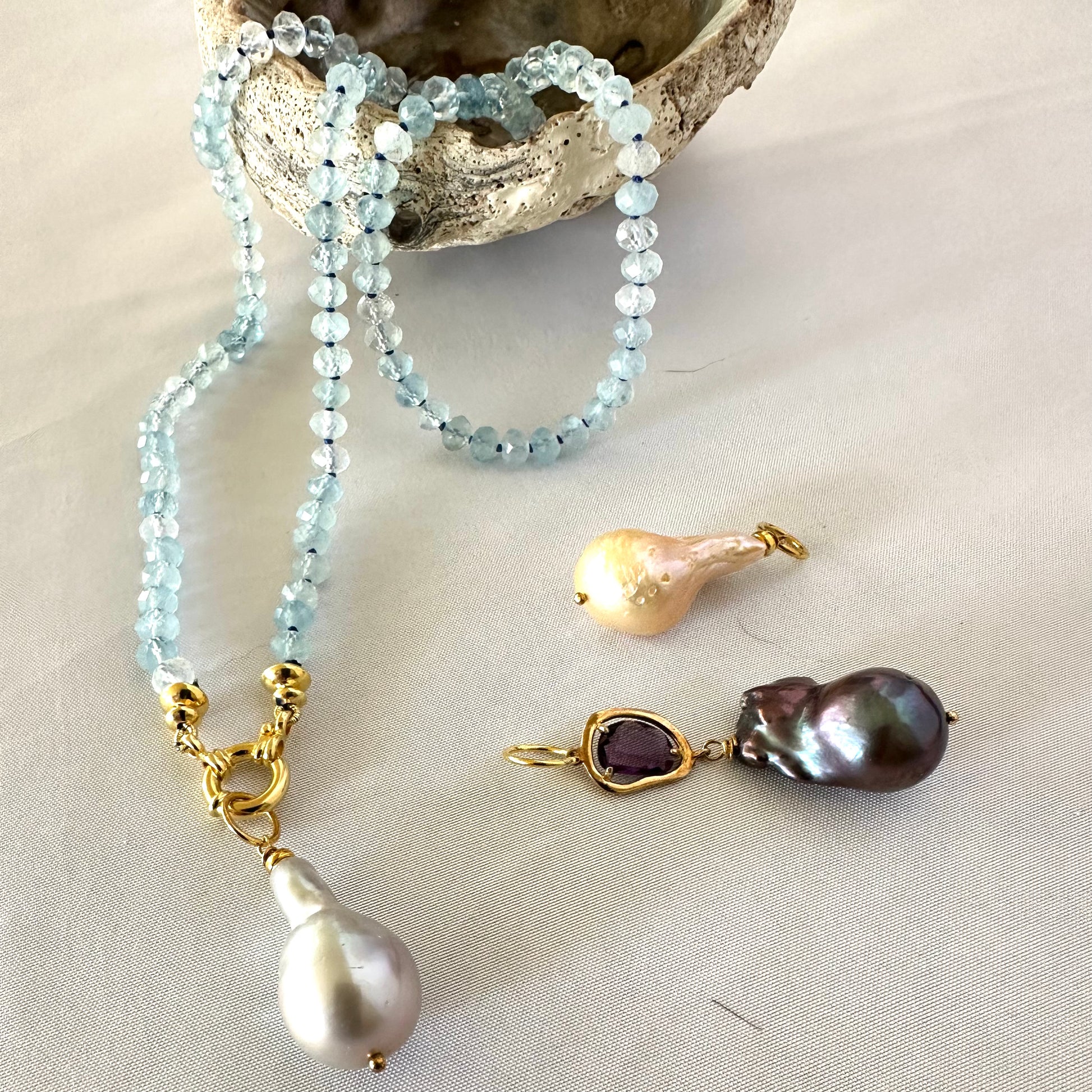 Aquamarine baroque pearl necklace featuring tender blue beads and luminous Baroque pearl pendants.