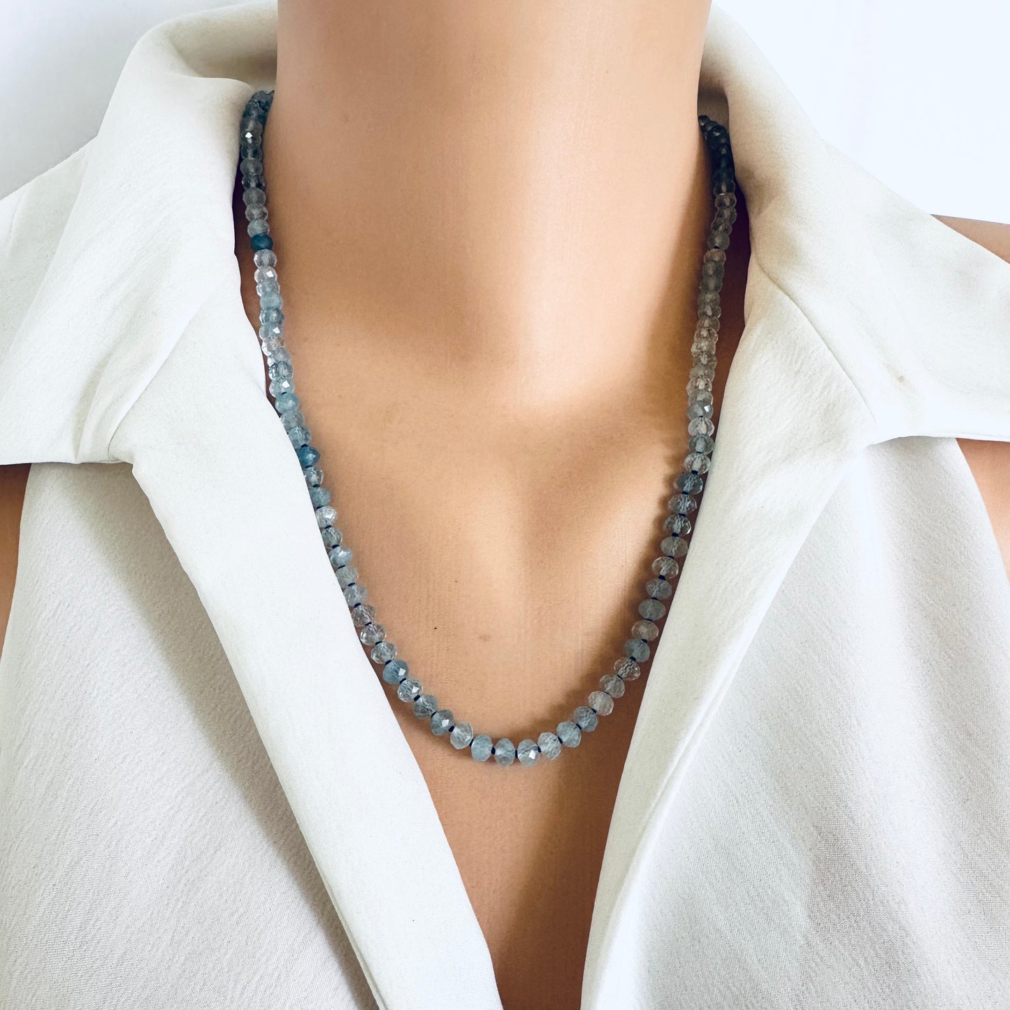 Aquamarine baroque pearl necklace displayed on a model's neck, showcasing tender blue Aquamarine beads.