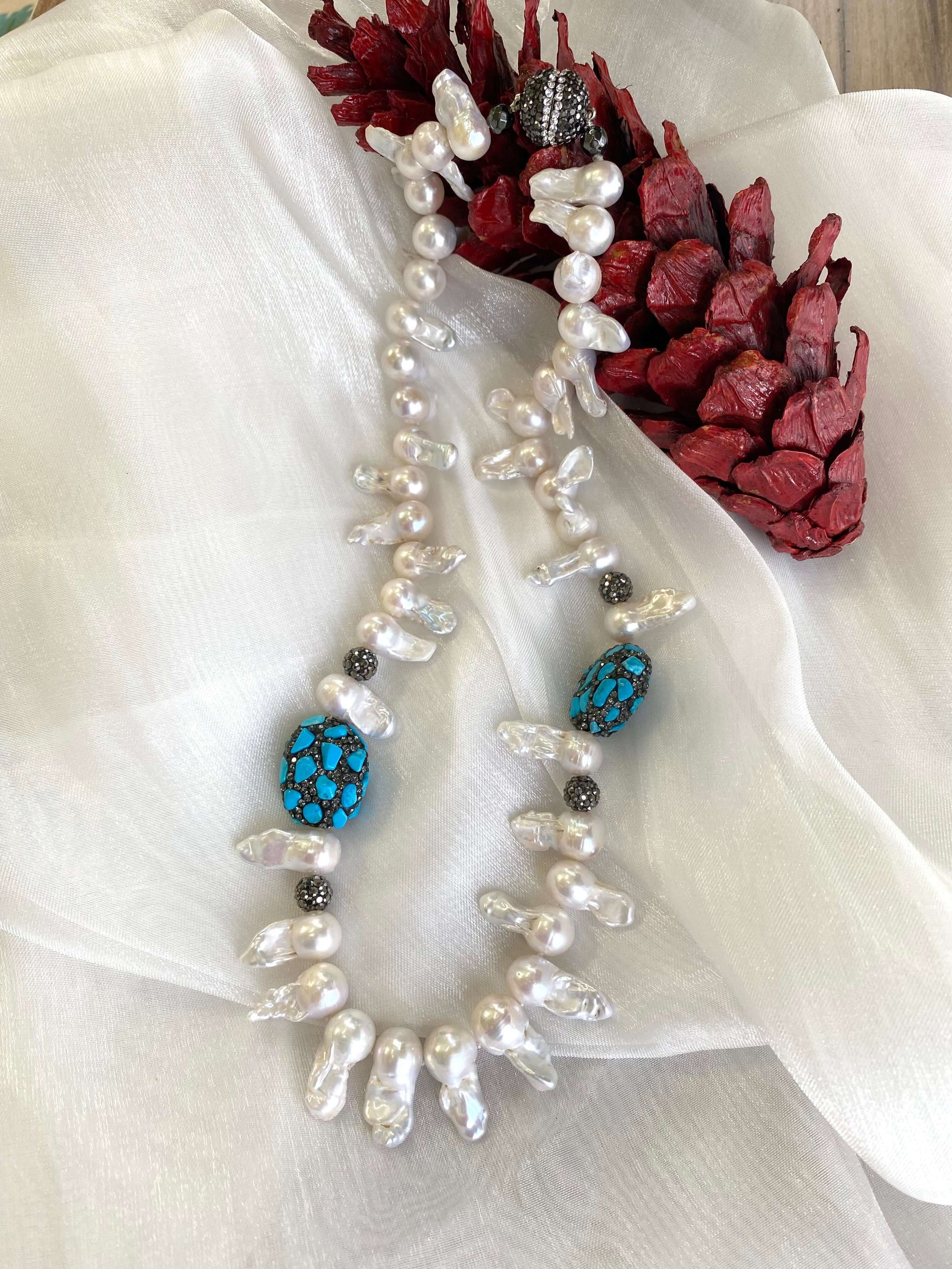 Baroque pearl jellyfish necklace on white cloth with rhinestone accents handmade in Canada