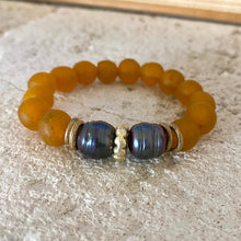 Load image into Gallery viewer, Black pearl bracelet featuring tangerine recycled glass beads and unique black freshwater pearls for a vibrant contrast.
