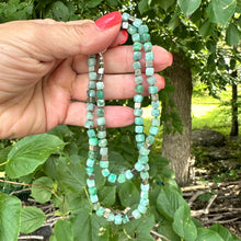 Charger l&#39;image dans la galerie, Emerald Pyrite Candy Necklace displayed, showcasing handcrafted design with emerald cube-cut gemstones and pyrite.
