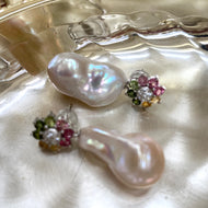 Tourmaline pearl earrings with multicolor gemstones and white baroque drops on pearl background
