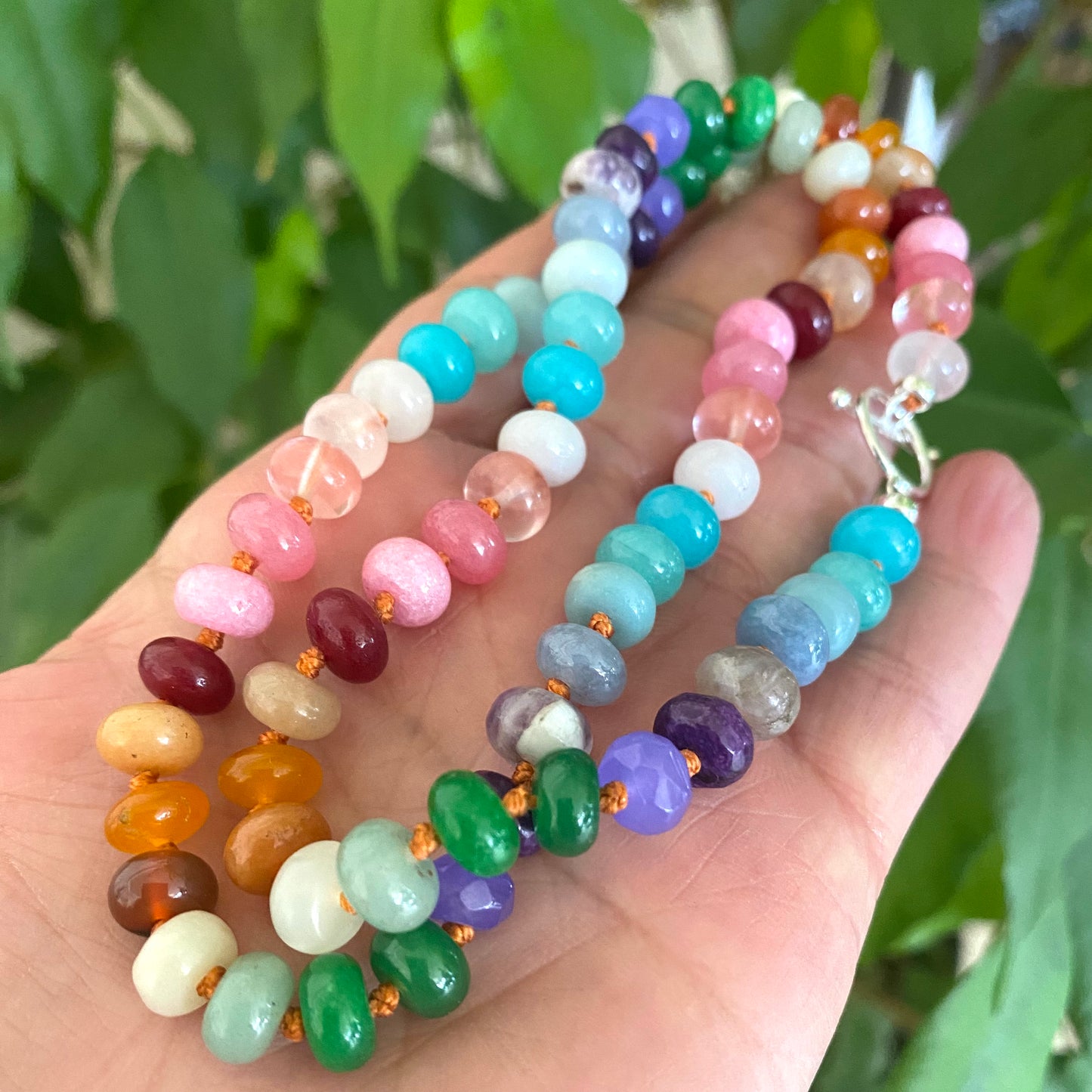 Colorful rainbow candy necklace with silver clasp showcasing vibrant gemstone rondelle beads and artisanal craftsmanship.