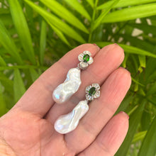 Charger l&#39;image dans la galerie, Green diopside baroque pearl drop earrings held in hand against green leaves — handcrafted gemstone jewelry by Loulia Pearl Jewelry
