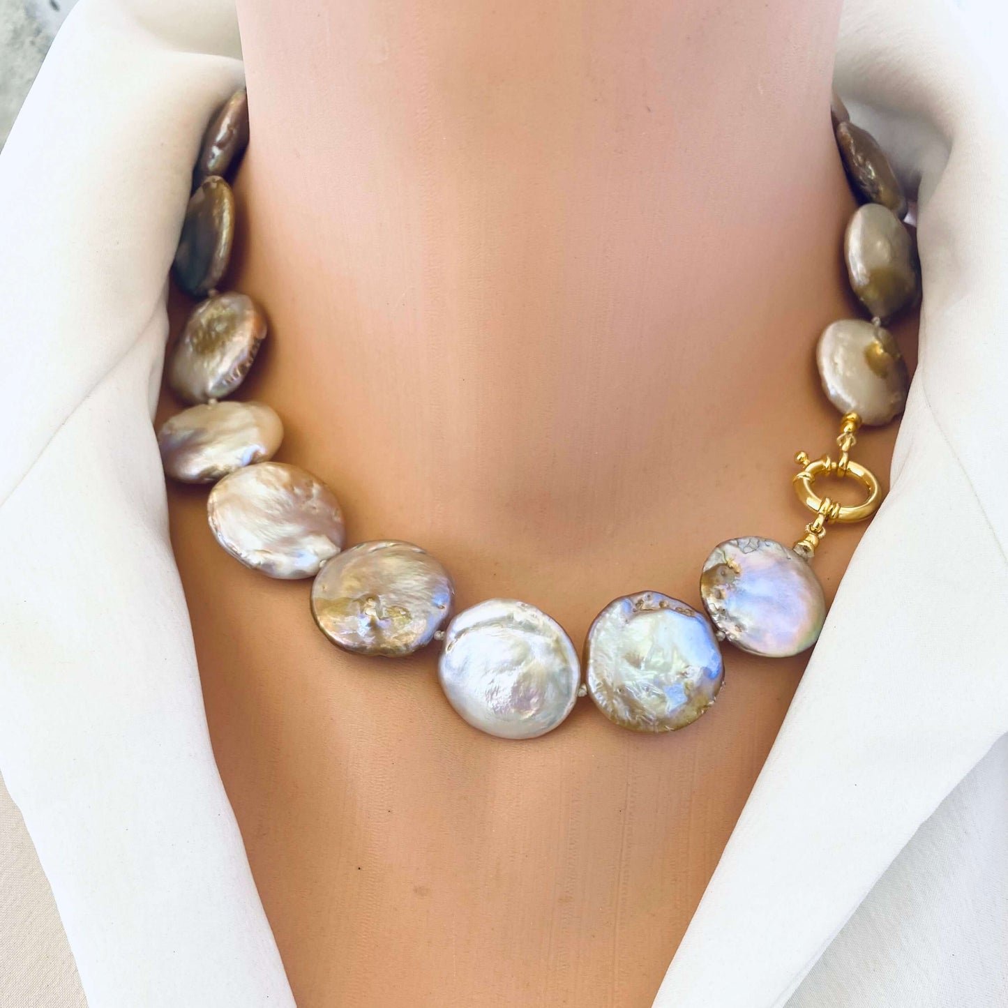 Front view of large coin pearl necklace on mannequin, classic 18-inch design