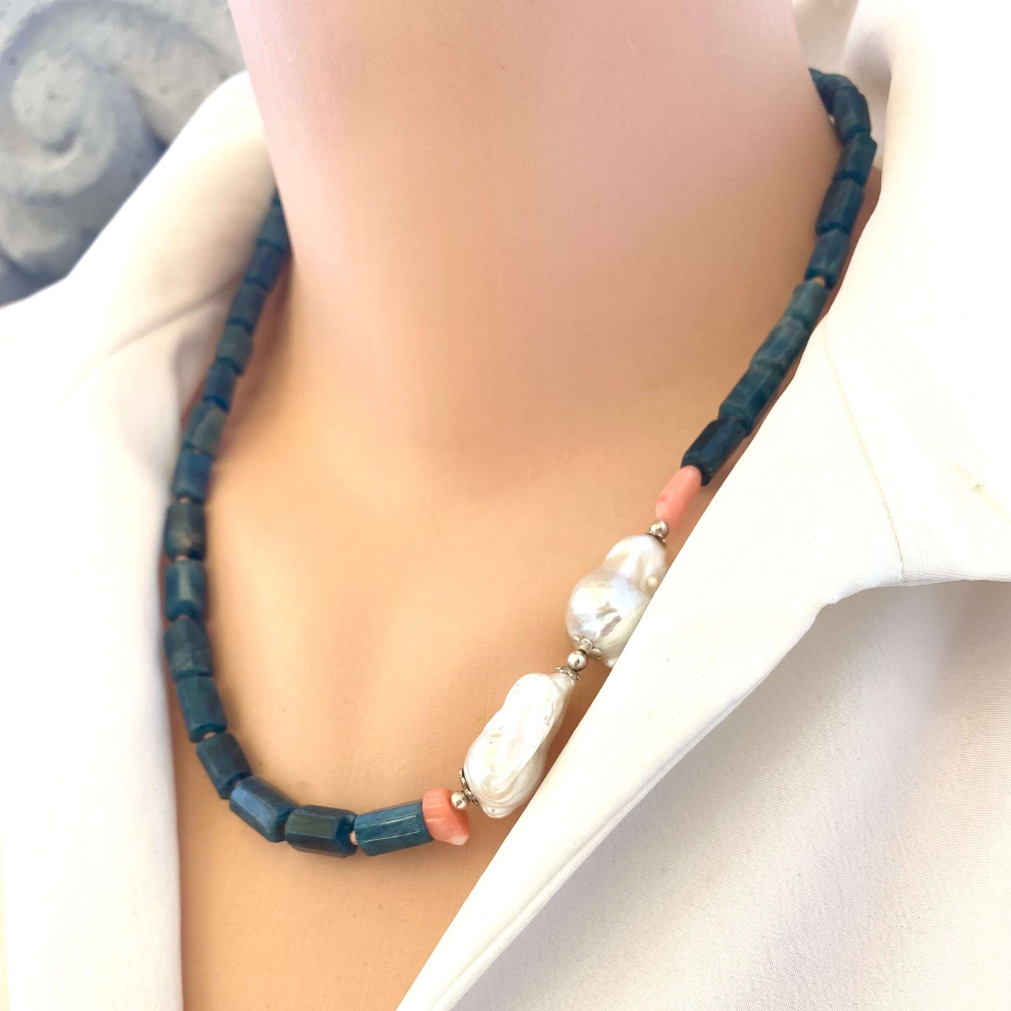 Side angle of blue apatite coral pearl necklace on mannequin — elegant handcrafted gemstone necklace with coral and pearl details