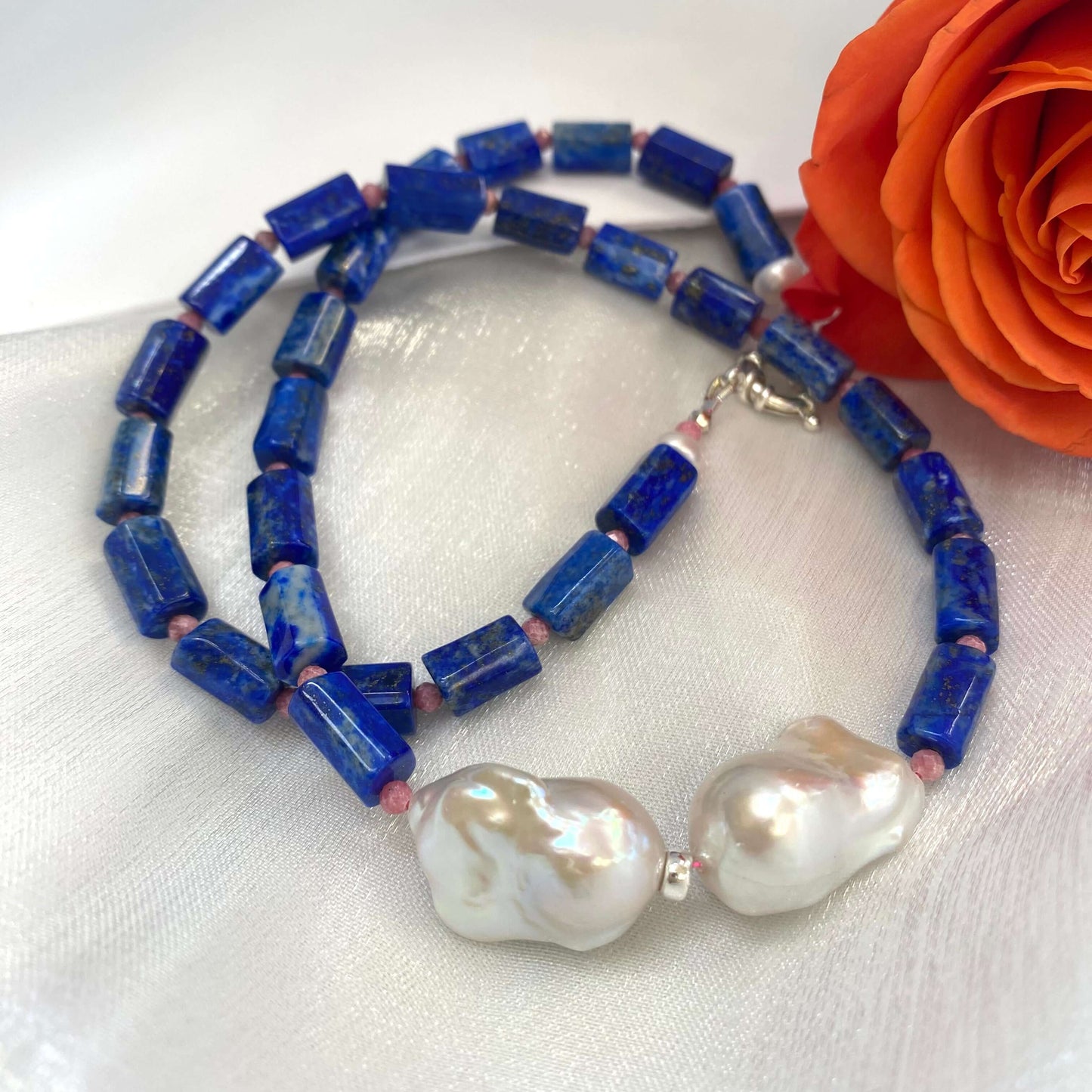 Close-up of Lapis Lazuli Pink Rhodonite Baroque Pearl Necklace on white background — lapis, rhodonite, and baroque pearl details by Loulia Pearl Jewelry