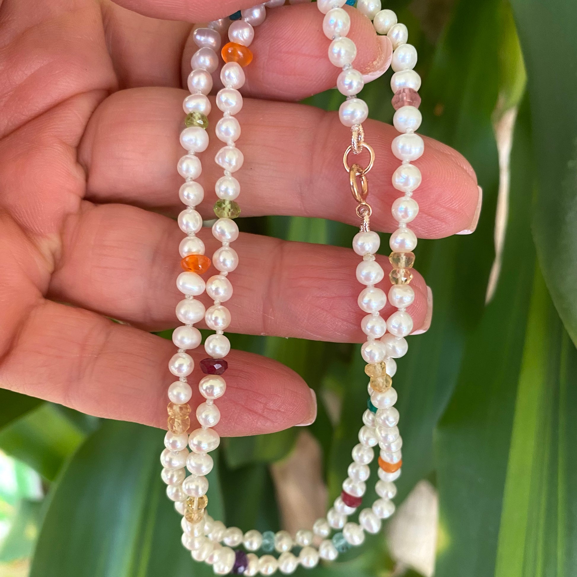 Rainbow gemstone pearl necklace featuring multi faceted gemstones and tiny pearls