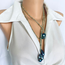 Load image into Gallery viewer, Green Prehnite and Black Baroque Pearls Lariat Necklace displayed on a mannequin, showcasing its elegant design.
