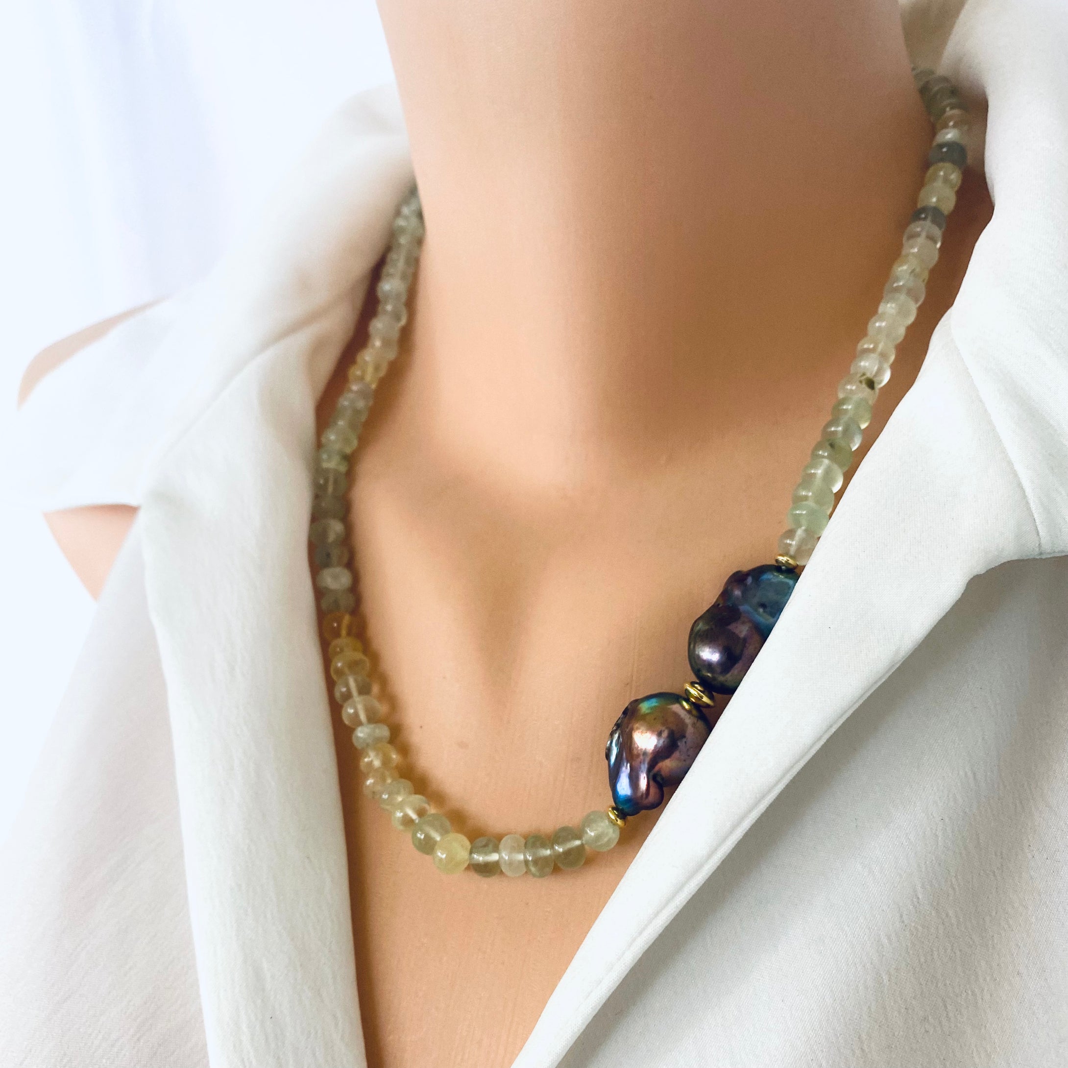 Prehnite and Black Baroque Pearl Necklace displayed on a mannequin, showcasing translucent green beads and striking black pearls.