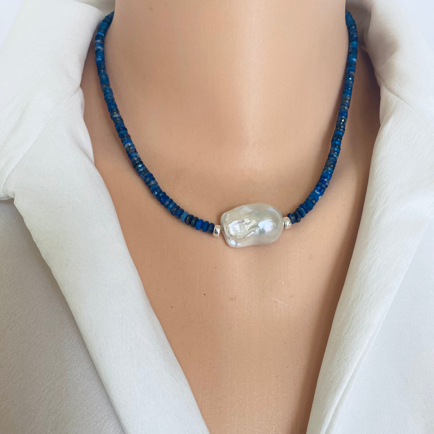 Lapis Lazuli Baroque Pearl Necklace showcasing deep blue gemstones and a classic pearl centerpiece.