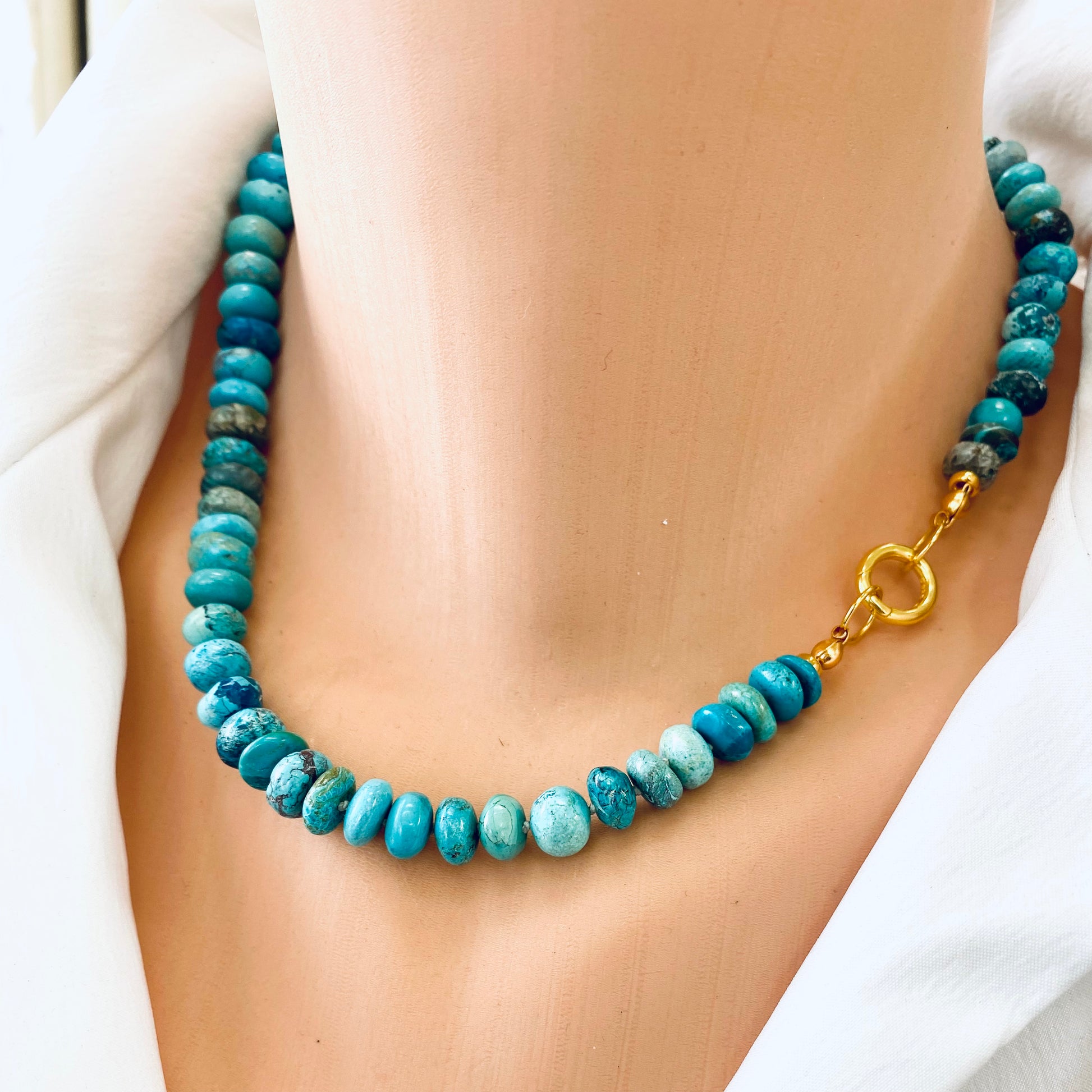 Turquoise candy necklace featuring Arizona turquoise rondelle beads with gold clasp, showcasing vibrant blue-green tones.
