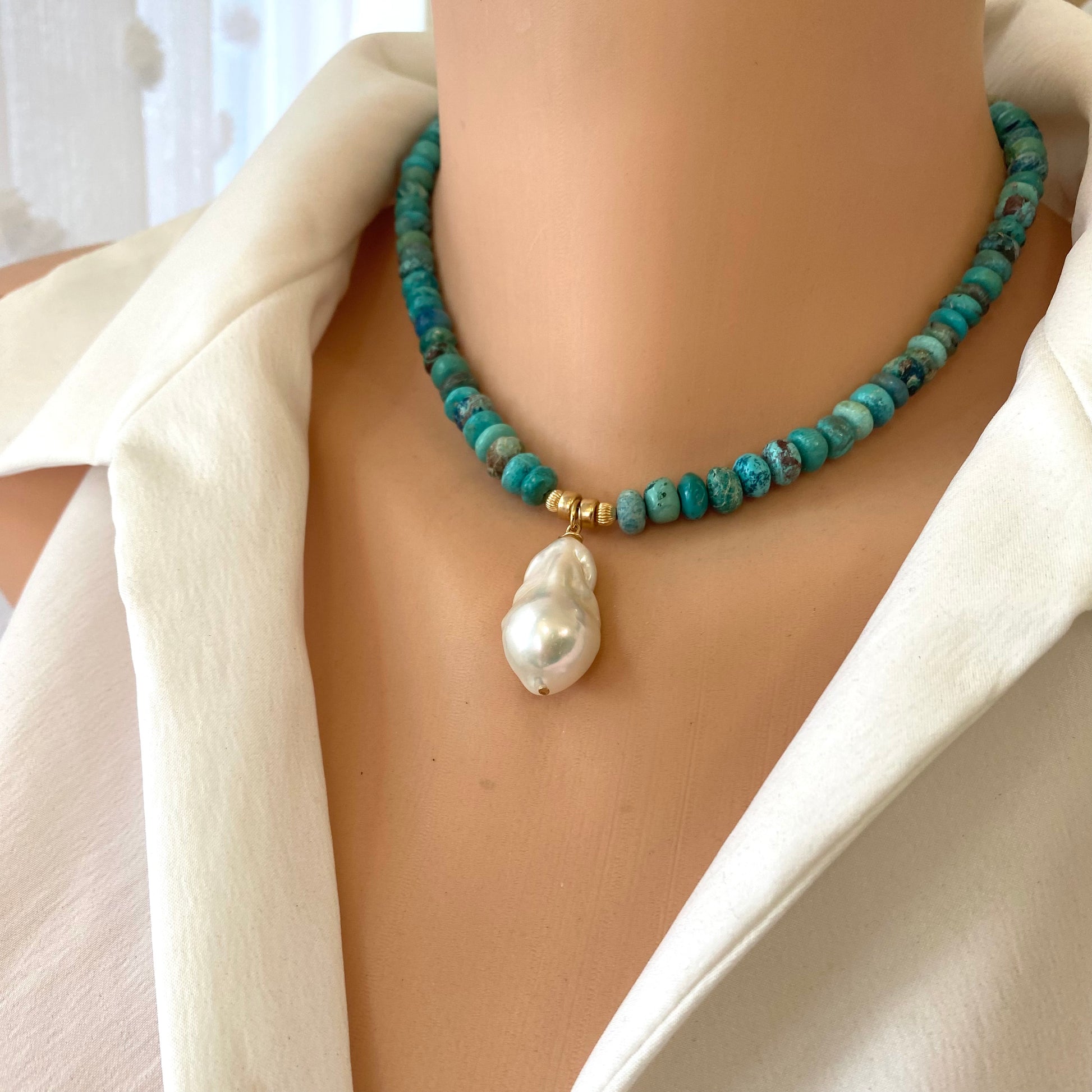 Turquoise pearl necklace featuring Arizona turquoise beads and a baroque pearl pendant, showcasing earthy elegance.