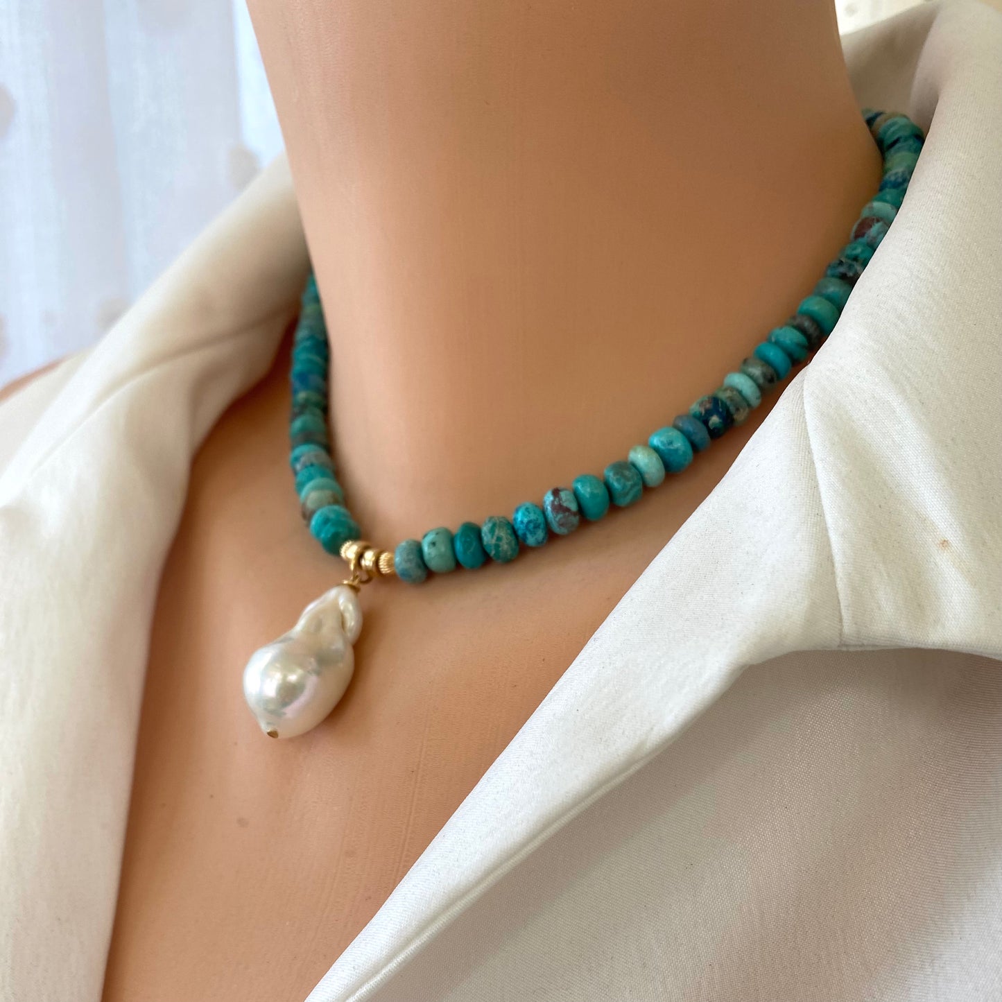 Turquoise pearl necklace featuring Arizona turquoise and a stunning baroque pearl, showcasing natural beauty and elegance.
