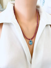Charger l&#39;image dans la galerie, Pink Tourmaline Blue Topaz Pendant displayed on a model, showcasing handcrafted December birthstone jewelry.
