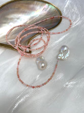 Charger l&#39;image dans la galerie, Pink Opal Baroque Pearl Necklace featuring pink opal beads and large baroque pearls against a pearl shell background
