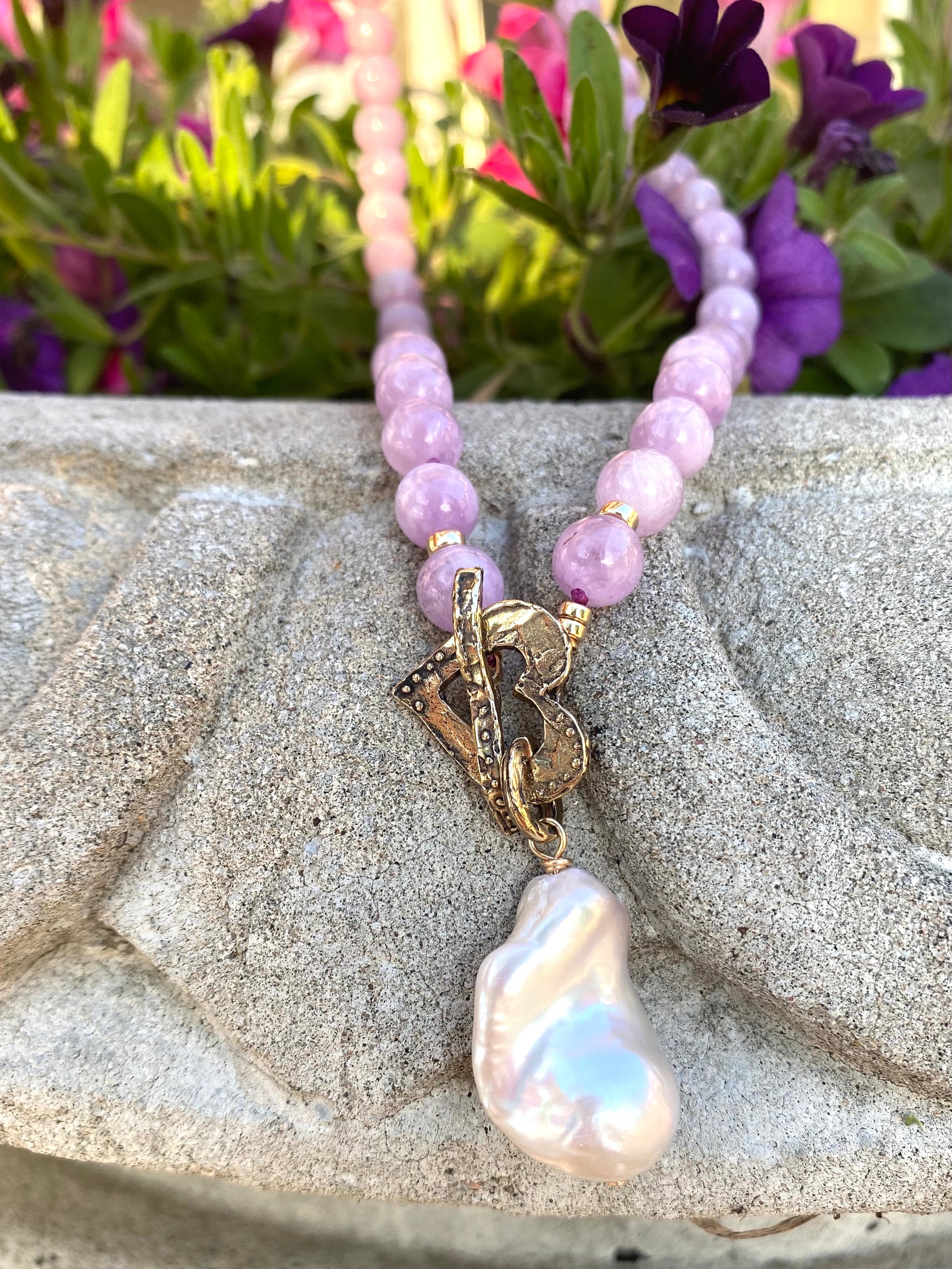 Kunzite toggle necklace with baroque pearl pendant showcasing pink kunzite beads and elegant craftsmanship.