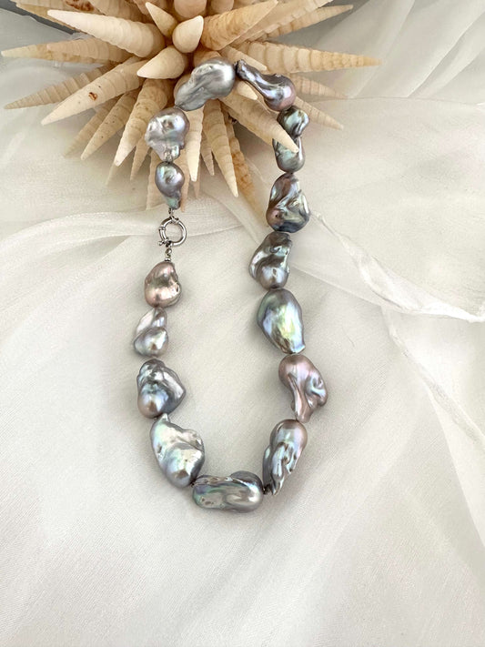 Baroque pearl necklace with silver details, handmade in Canada, featuring iridescent baroque pearls in organic shapes.